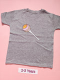 Grey children's T-shirt with pink and yellow lollipop design, size 2-3 years