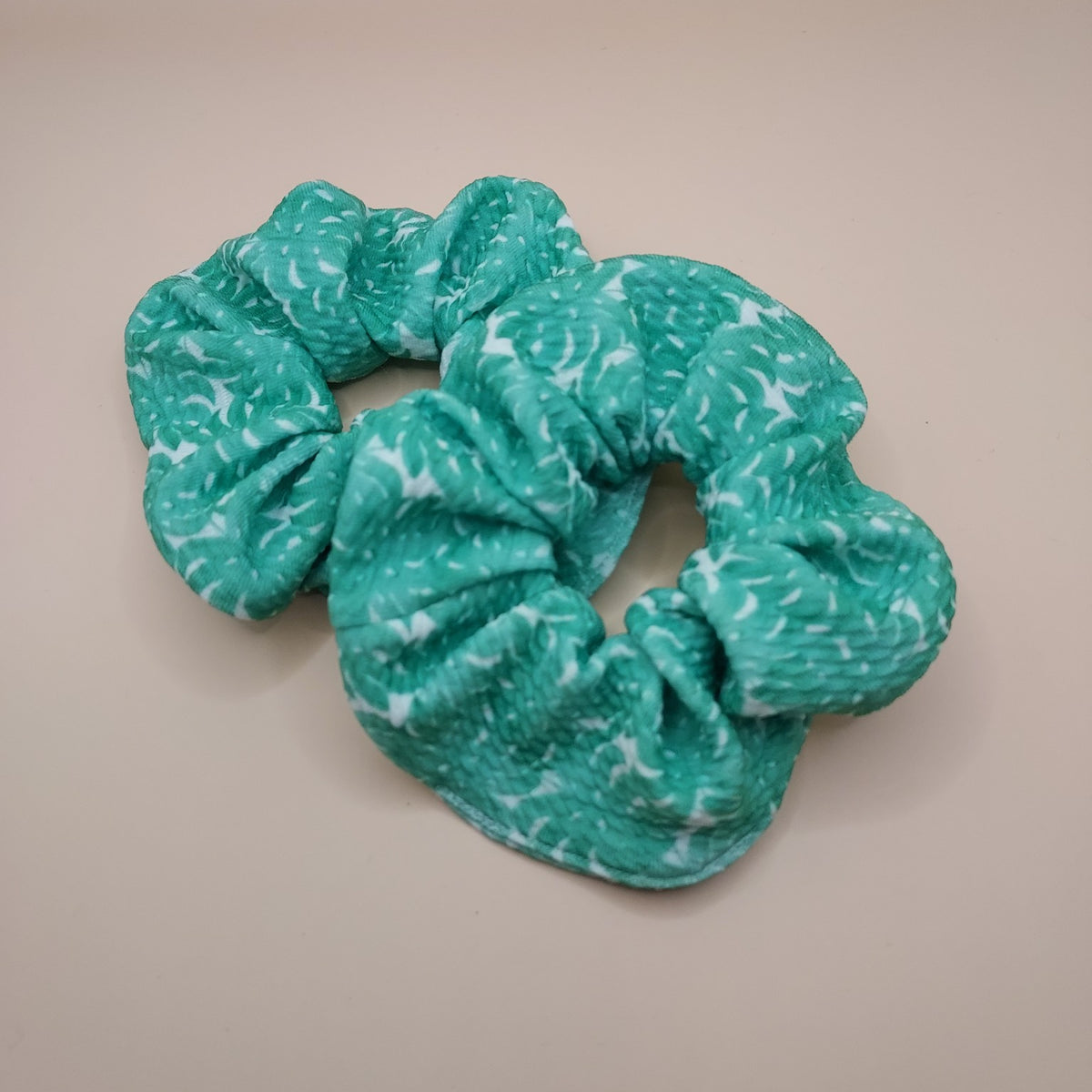 Handmade teal green scrunchie with white abstract print