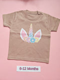Taupe children's T-shirt with pastel unicorn and floral design, size 6-12 months